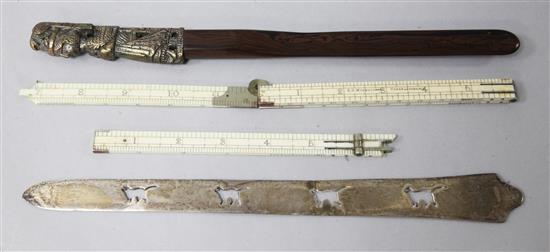 An Edwardian Asprey & Co. silver letter opener, a brass and rosewood letter opener and a folding ruler